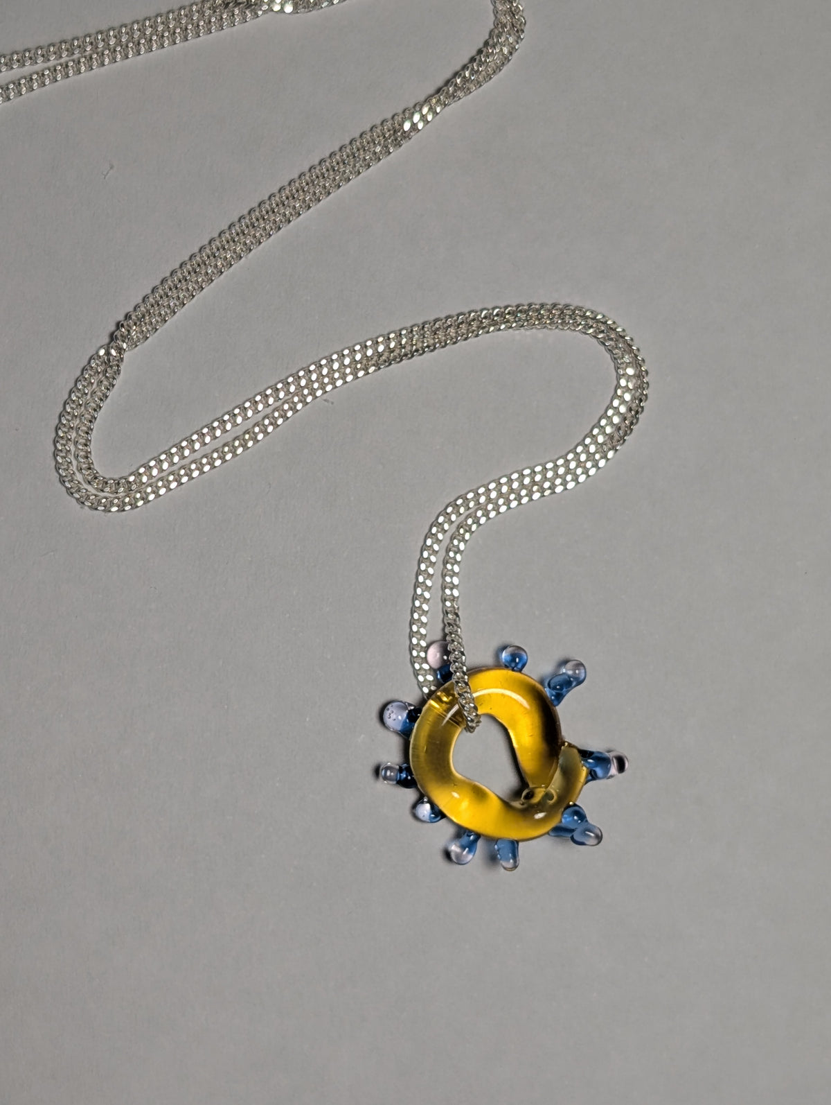 yellow glass charm