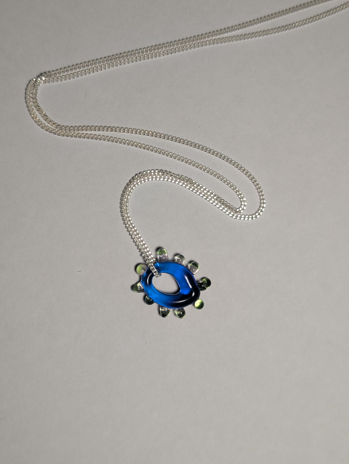 blue glass charm