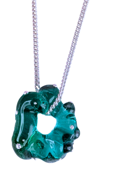 one unique necklace with different designs on a white background